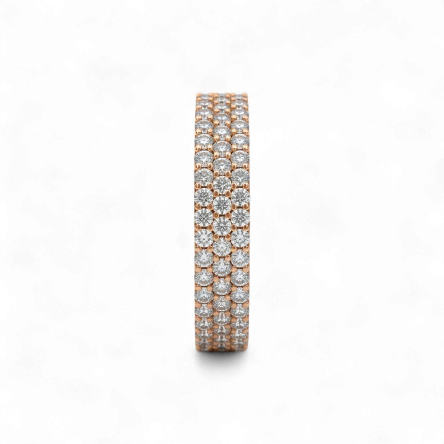 Rose gold and silver eternity ring with diamonds on a white background