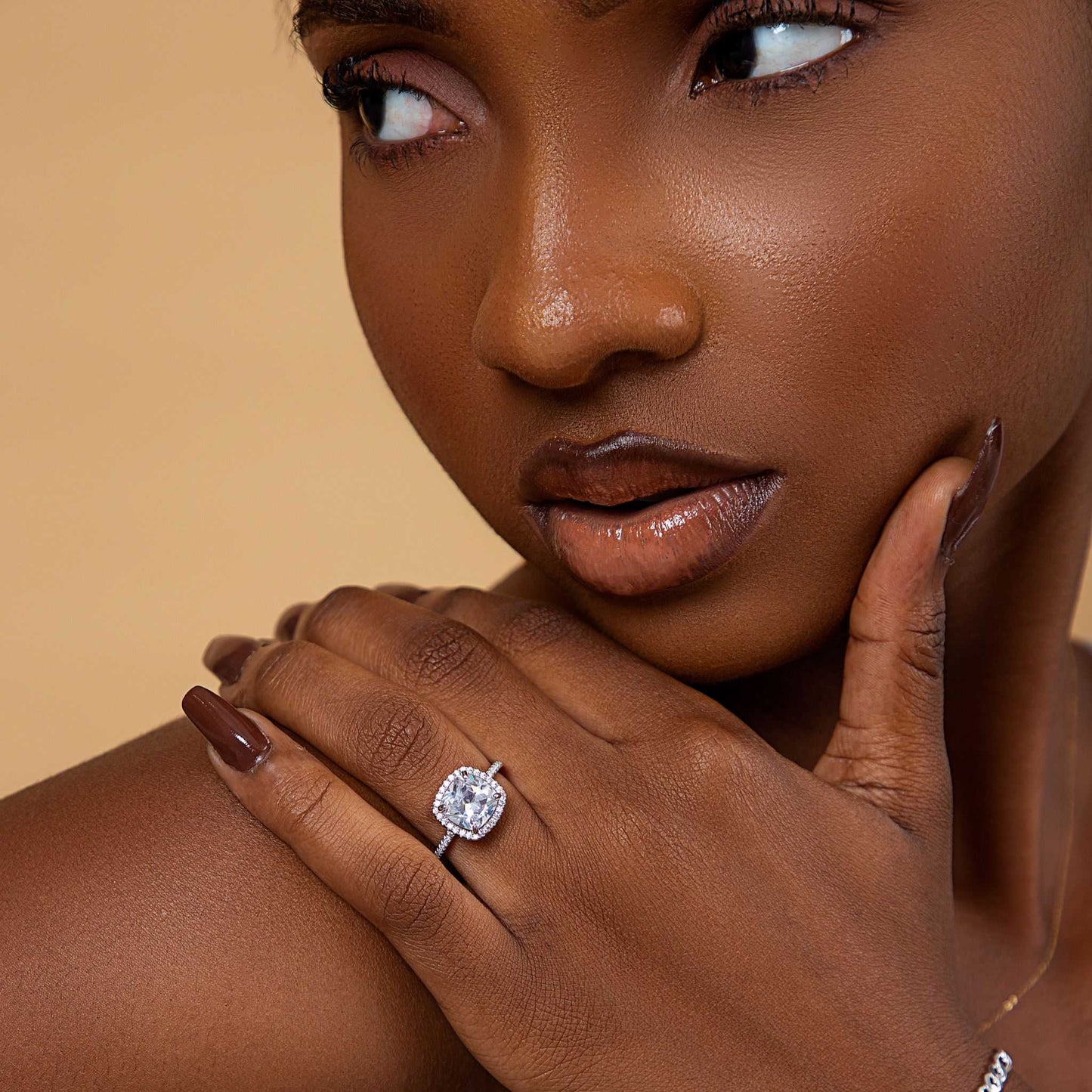 Adalaide princess cut CZ sterling silver engagement ring on woman's hand with brown nail polish