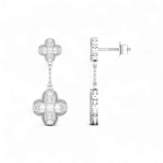 Pair of silver earrings with intricate designs on a white background