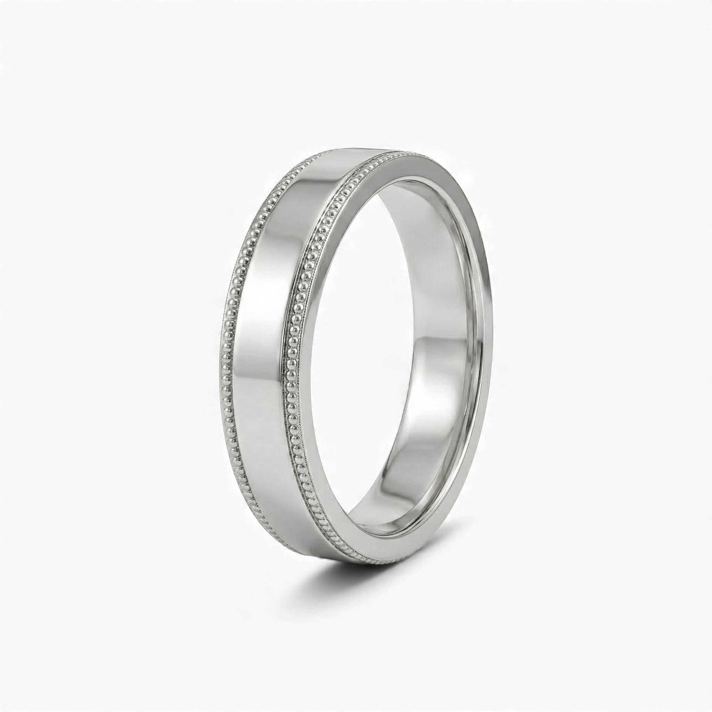 Silver ring with detailed design on a white background