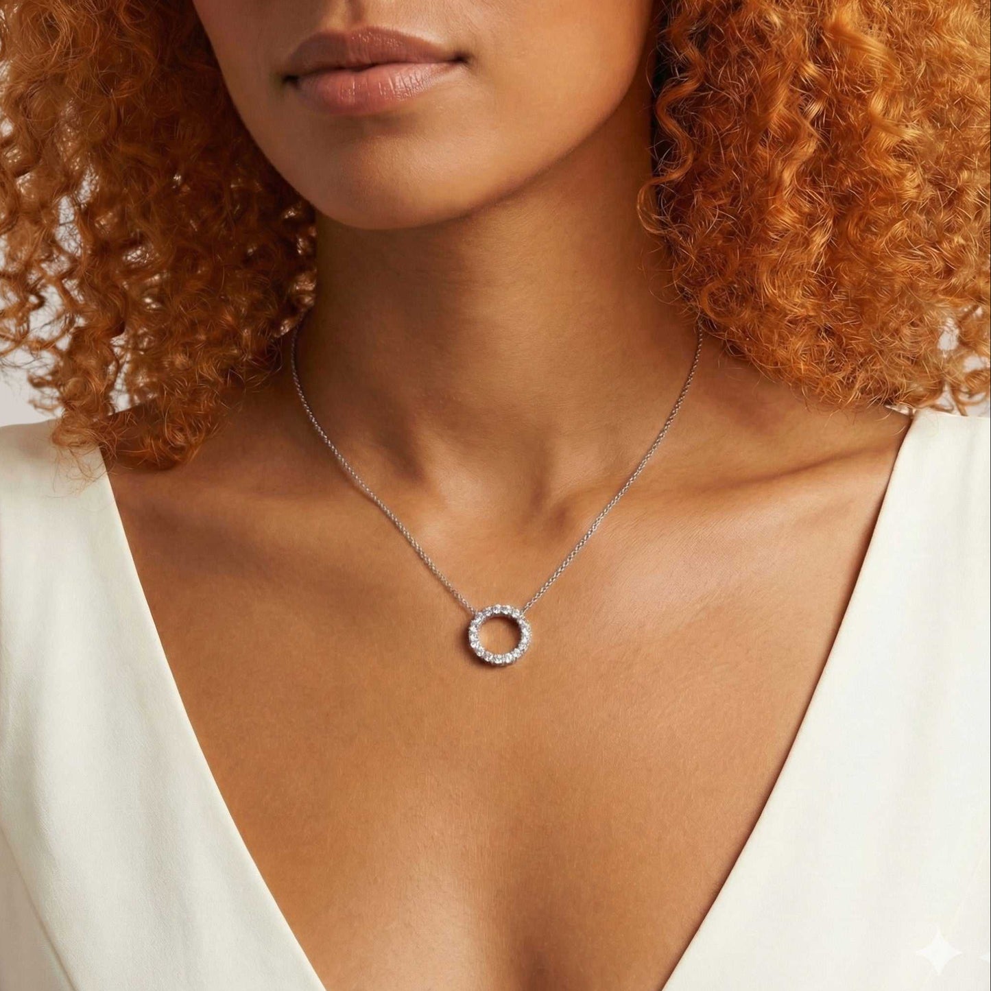 Woman wearing a necklace with a circular pendant