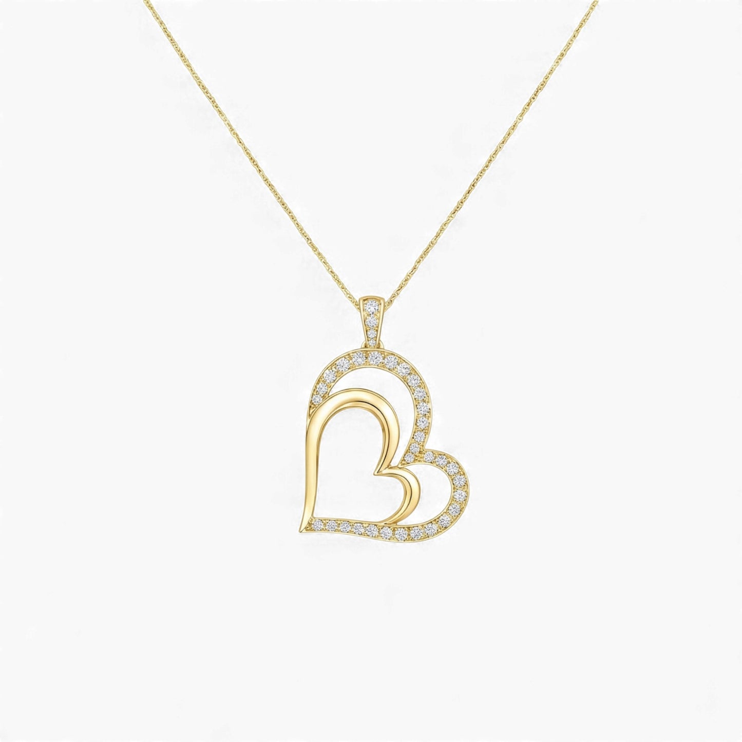 Gold heart-shaped pendant necklace on a white background
