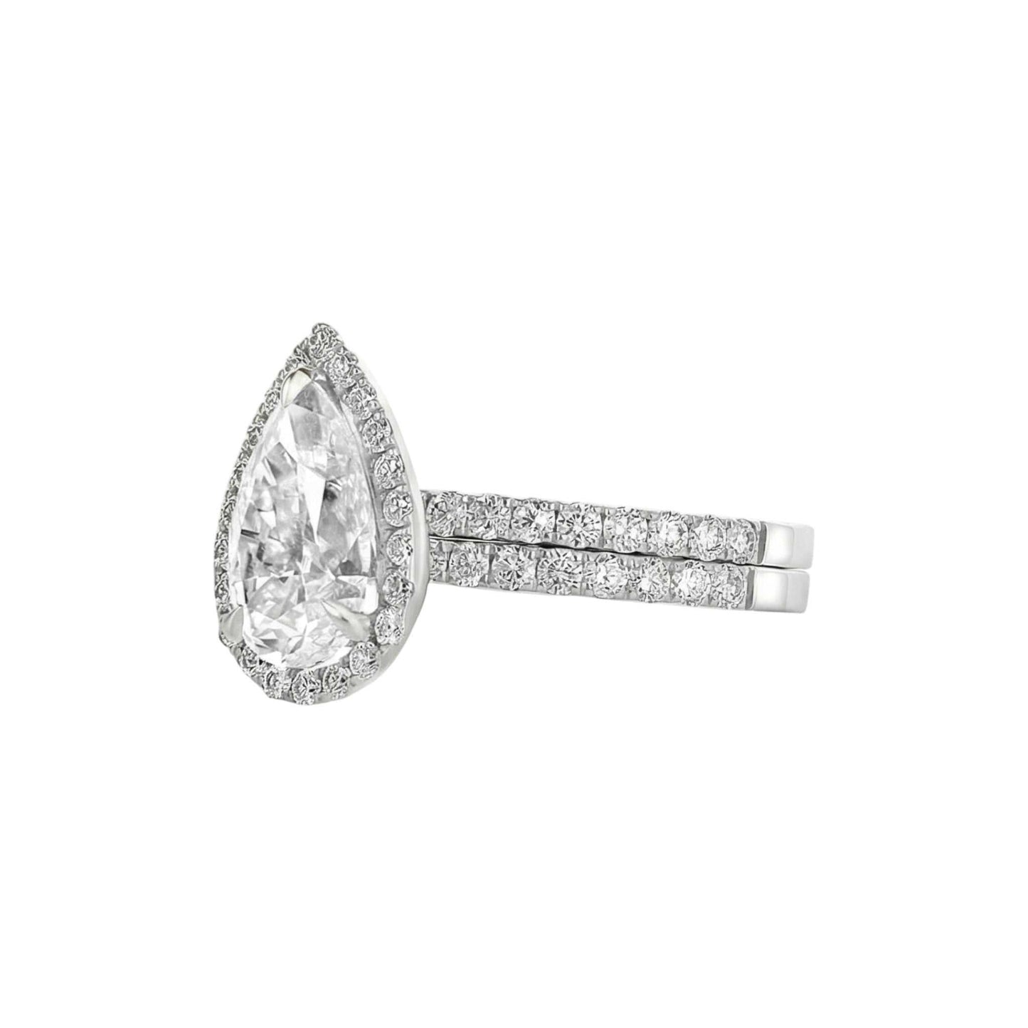 Diamond ring with a pear-shaped center stone on a white background