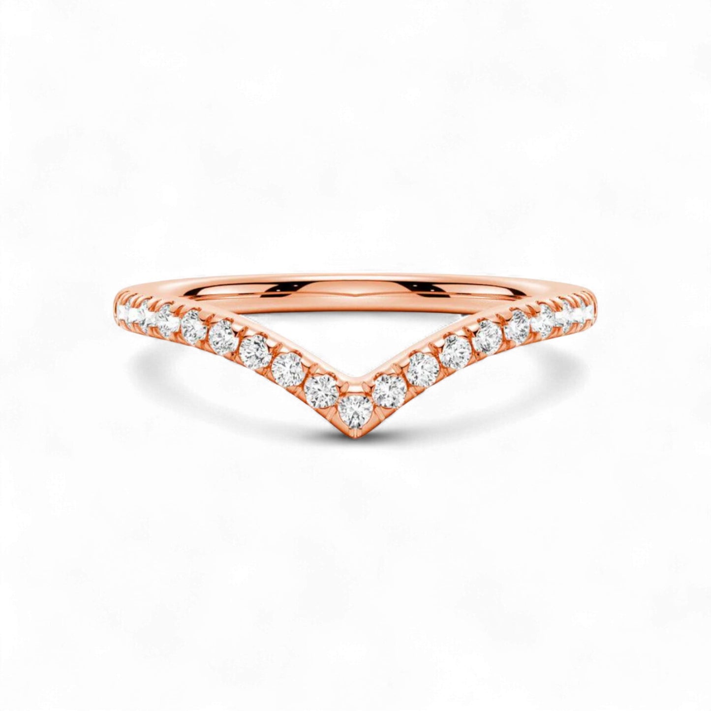Rose gold ring with diamond accents on a white background