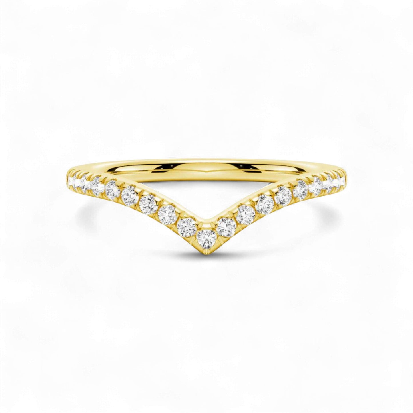 Gold ring with diamond accents on a white background