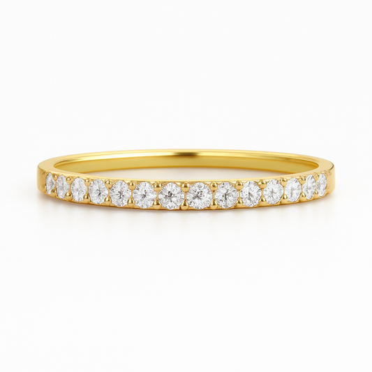 Gold ring with diamonds on a white background