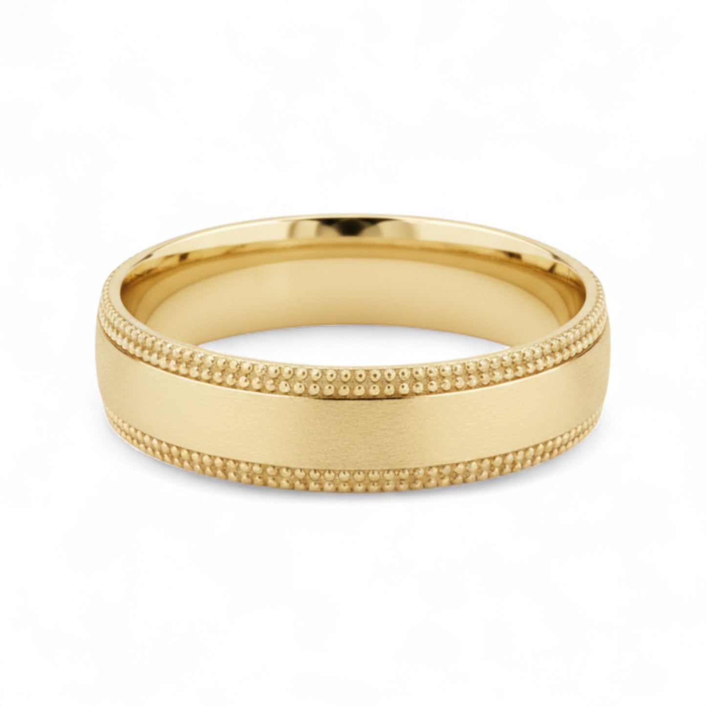 Gold ring with textured design on a white background