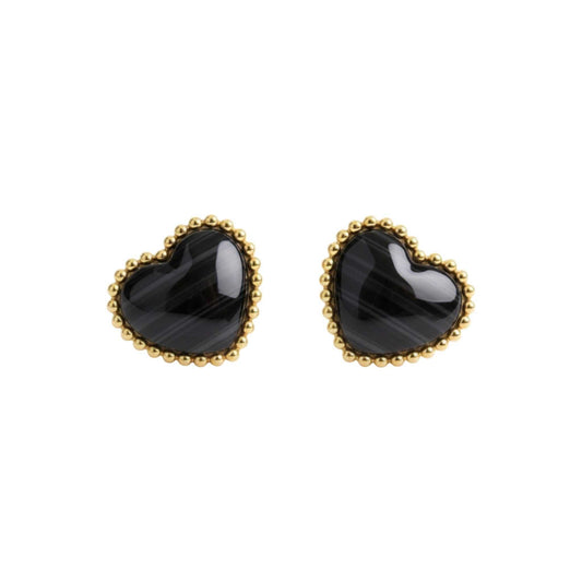 Heart-shaped black earrings with gold rims on a white background