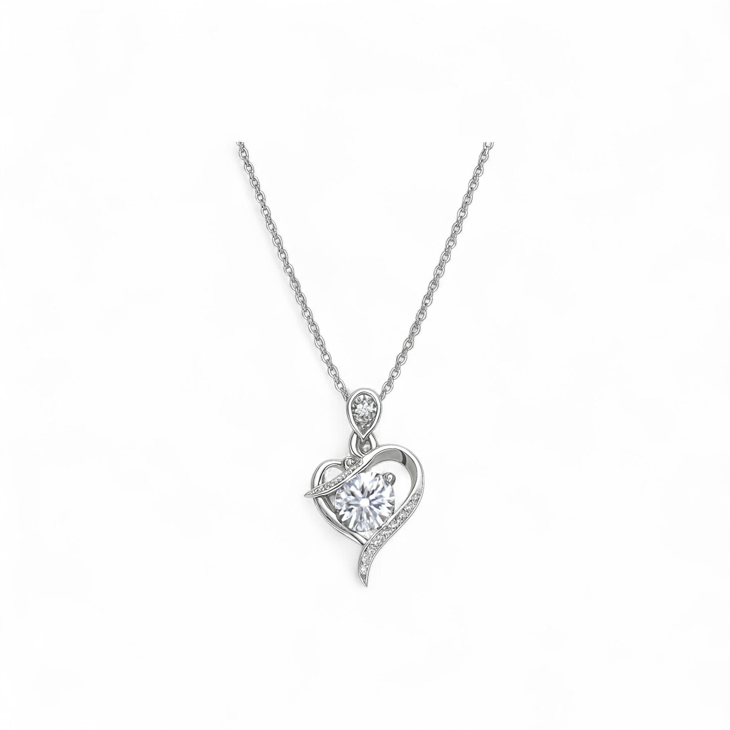 Silver heart-shaped pendant necklace on a white background