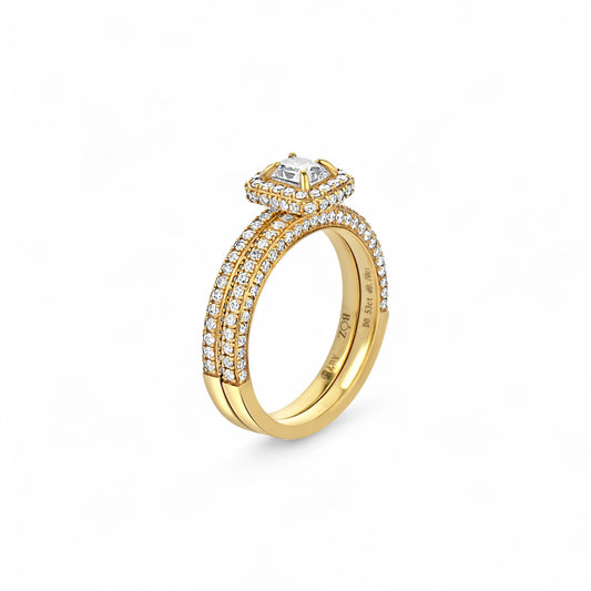 Gold ring with diamond accents on a white background