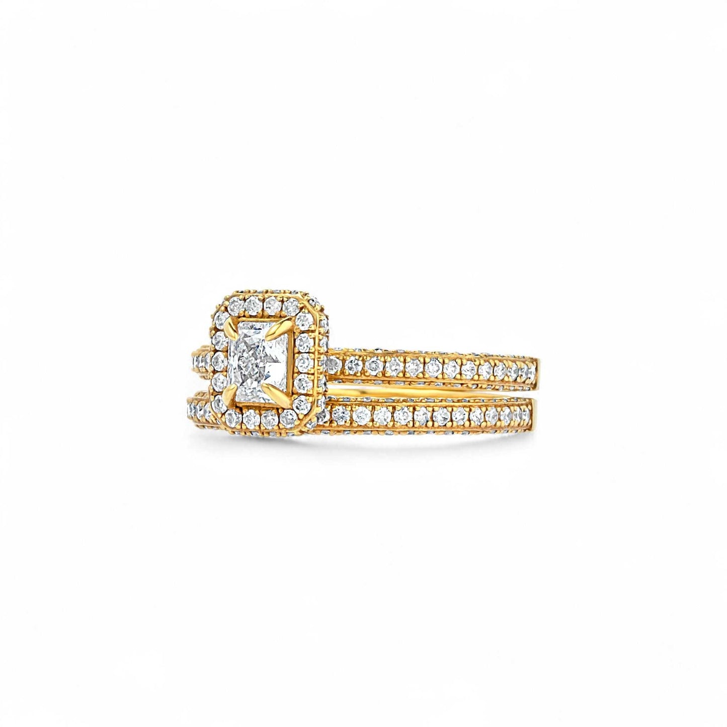 Gold ring with diamond accents on a white background