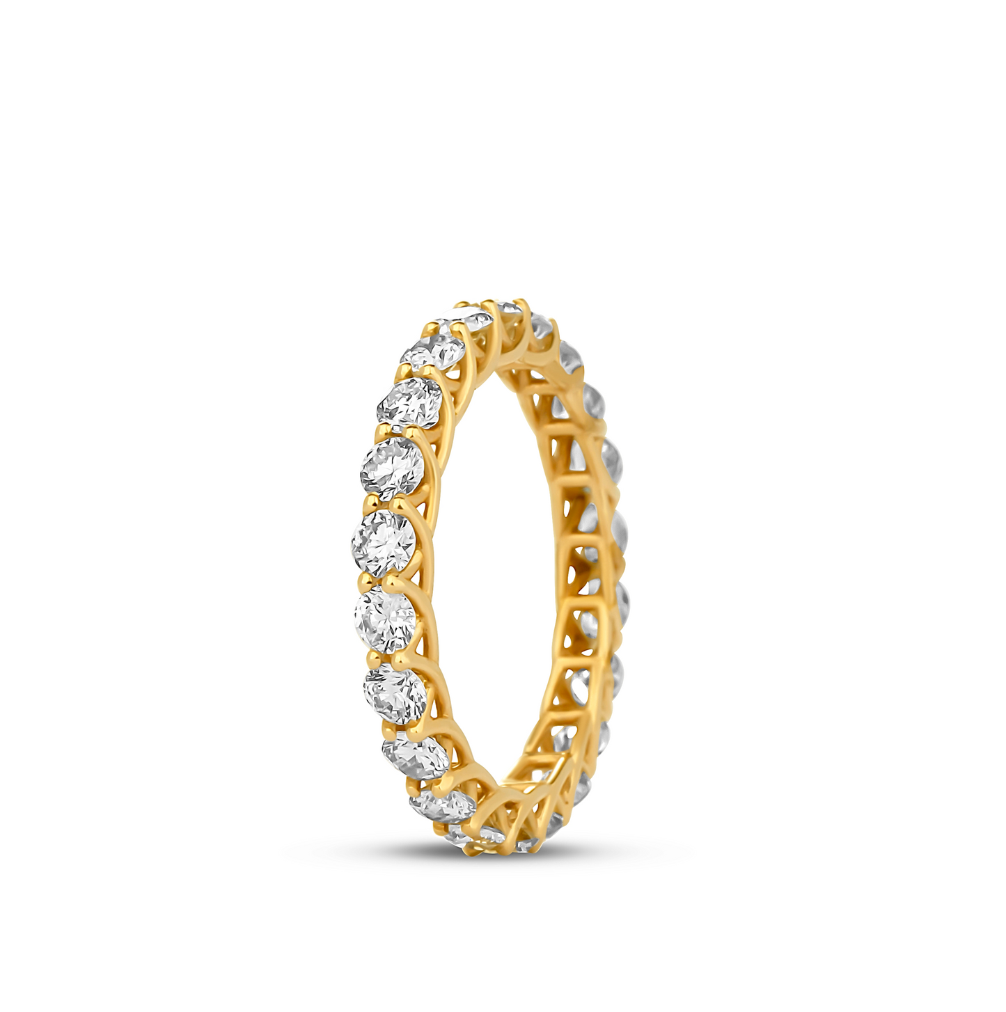 A gold band ring with a geometric pattern and multiple diamonds set around its circumference.