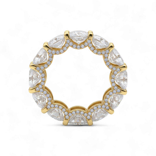 Gold ring with clear gemstones on a white background