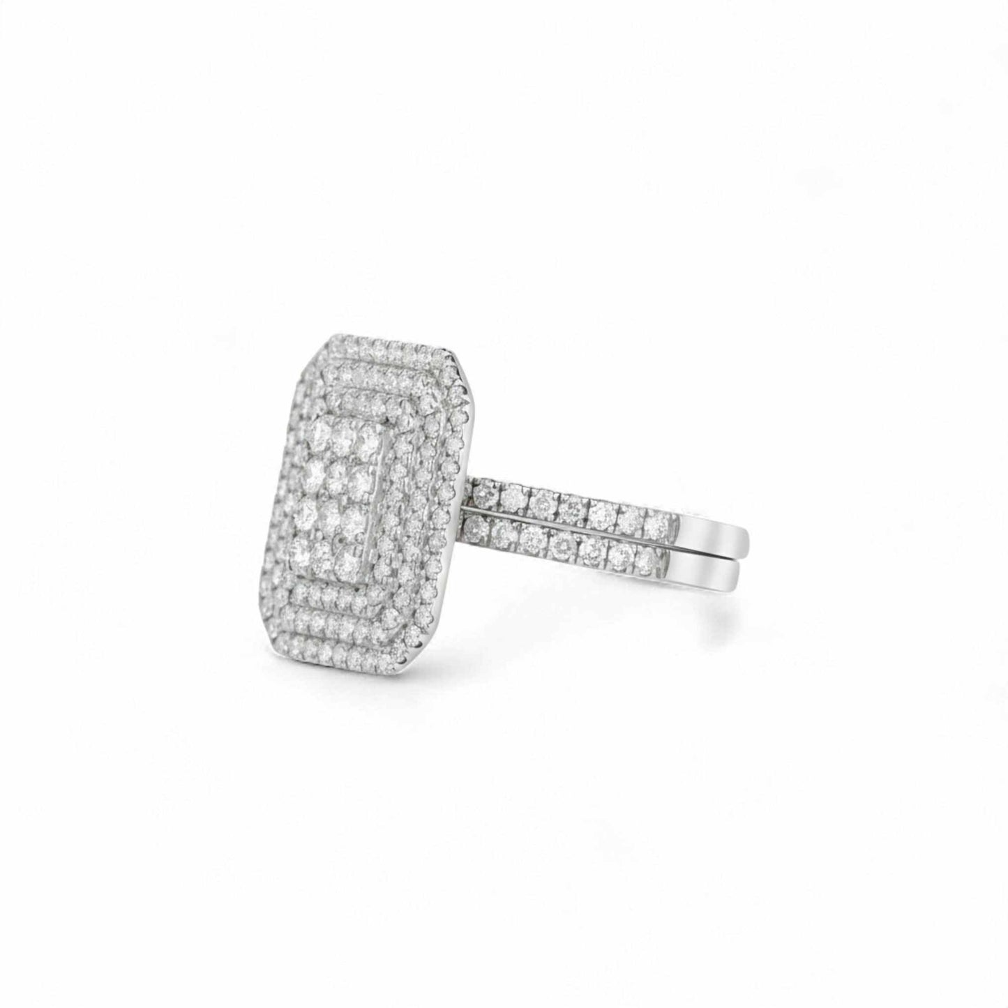 Silver ring with diamond accents on a white background