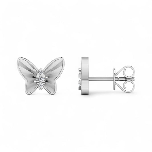 Butterfly-shaped silver earrings with a diamond on a white background