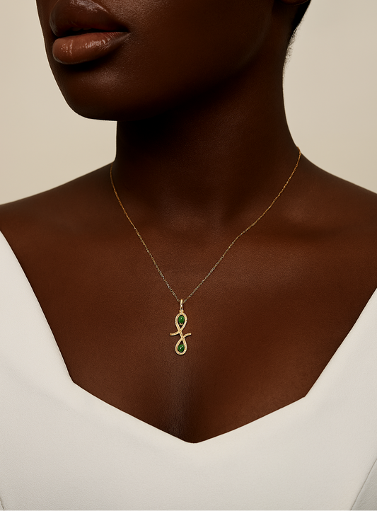 Necklace with a pendant worn by a model against a neutral background