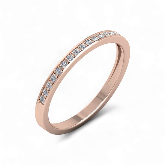 Rose gold ring with small diamonds on a white background