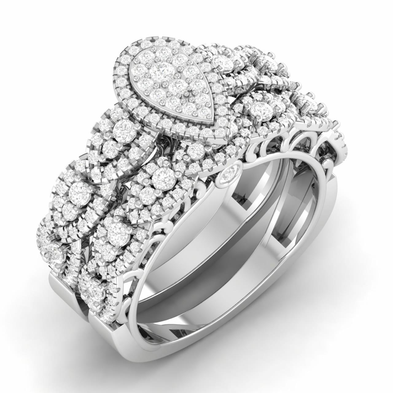A bride's ring set featuring a pear cut diamond centerpiece surrounded by smaller round and baguette cut diamonds set in 18 karat gold bands.