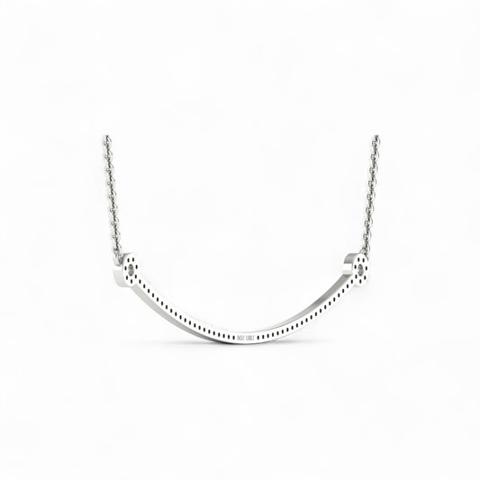 Silver necklace with a U-shaped pendant on a white background