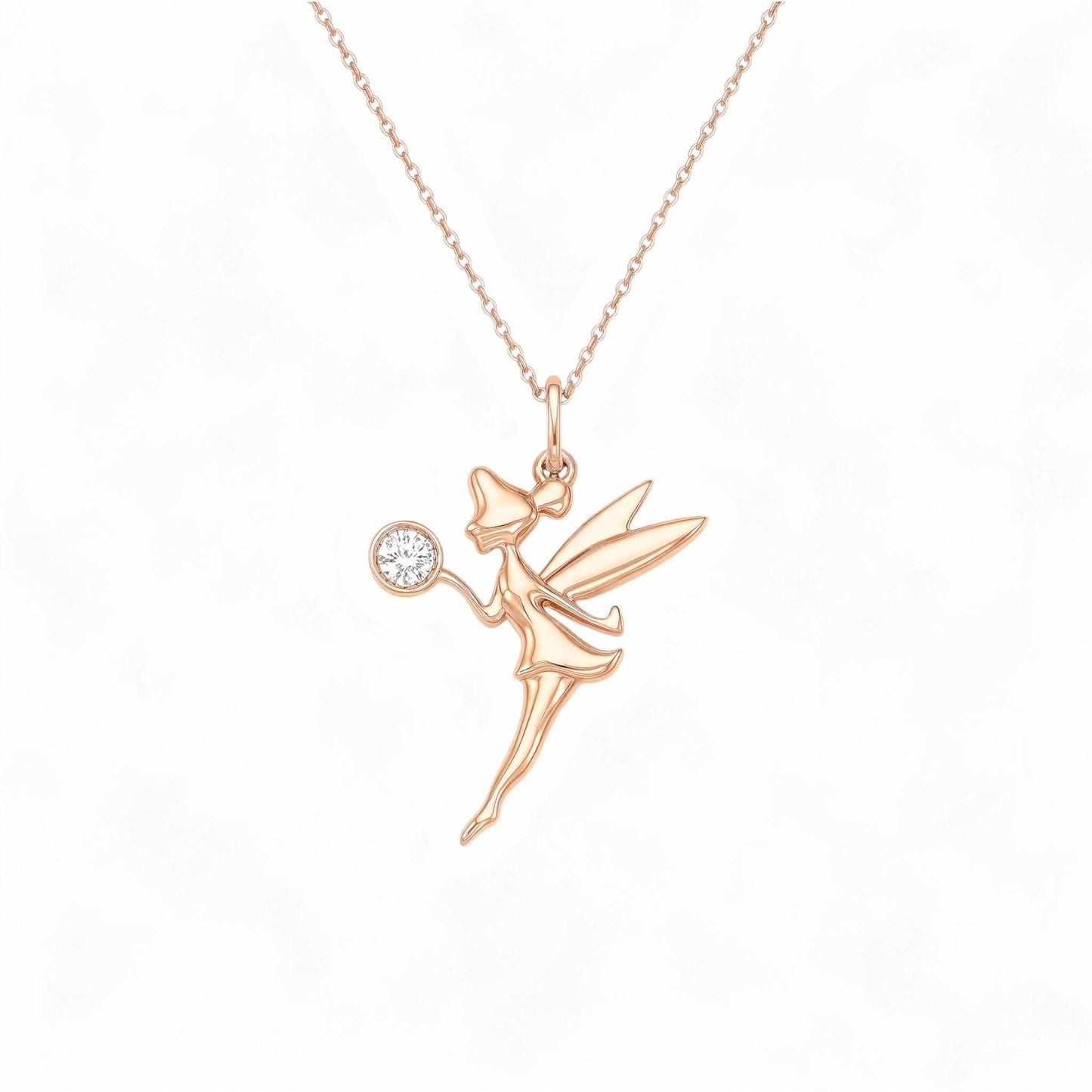 Rose gold fairy pendant necklace on a white background