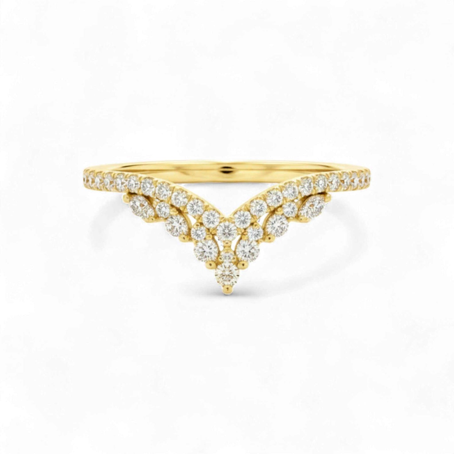 Gold ring with diamond accents on a white background