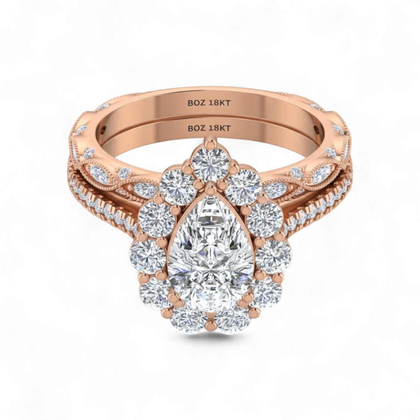 Rose gold ring with a pear-shaped diamond on a white background