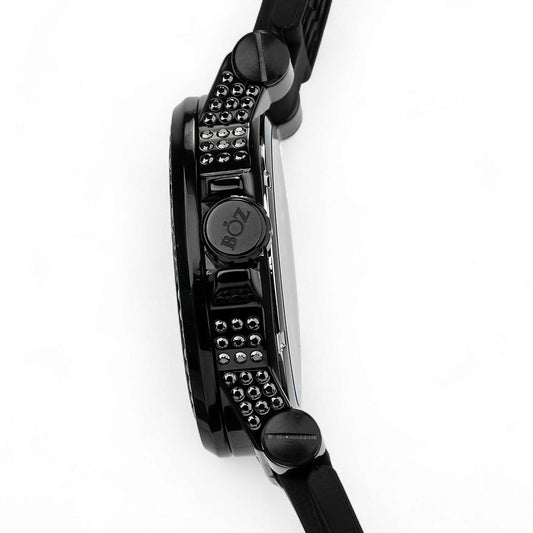 Close-up of a black wristwatch with detailed design on a white background