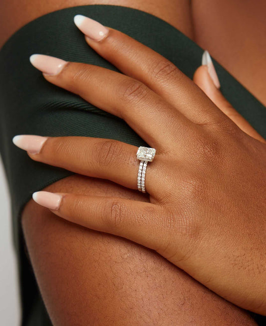 No Halo Radiant Cut Moissanite bridal set in 18K gold on hand