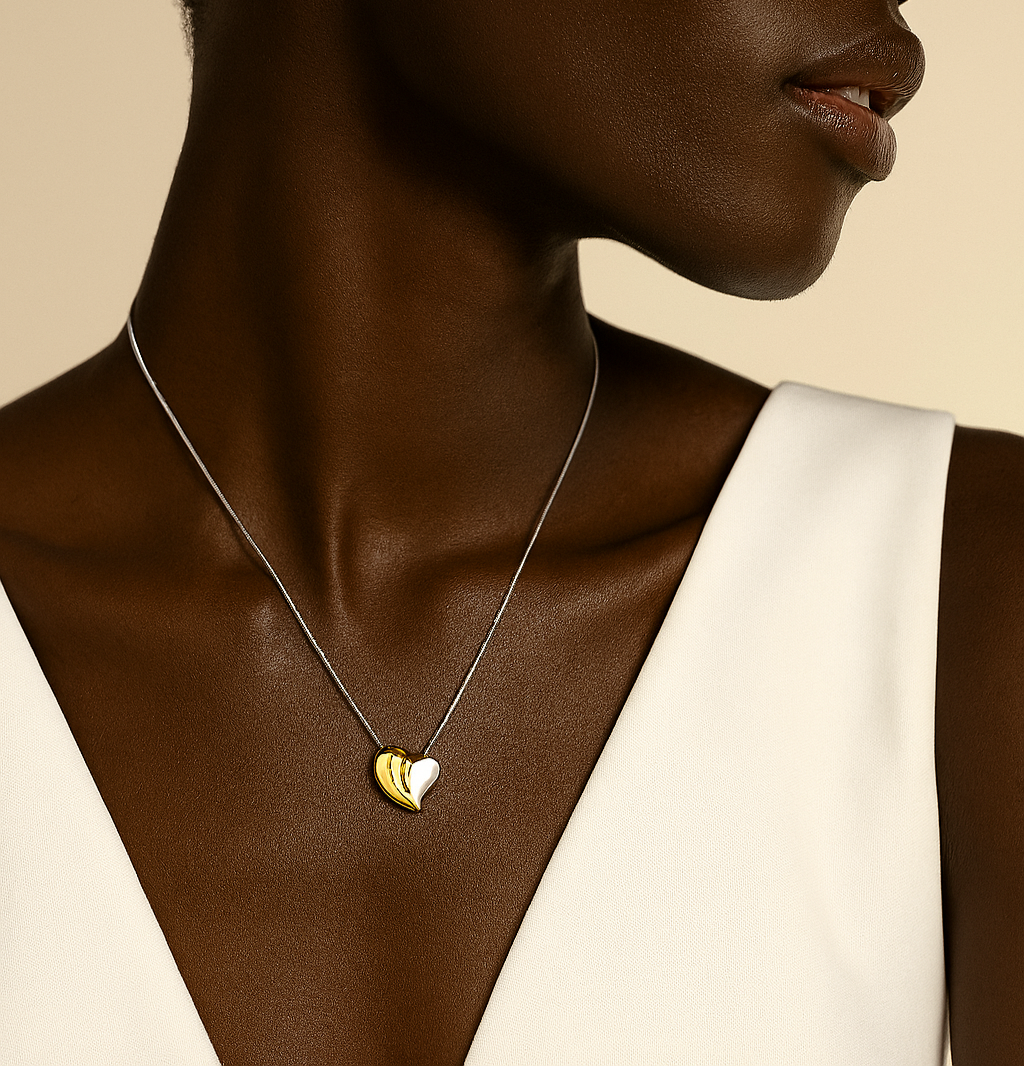 Woman wearing a necklace with heart pendants against a beige background