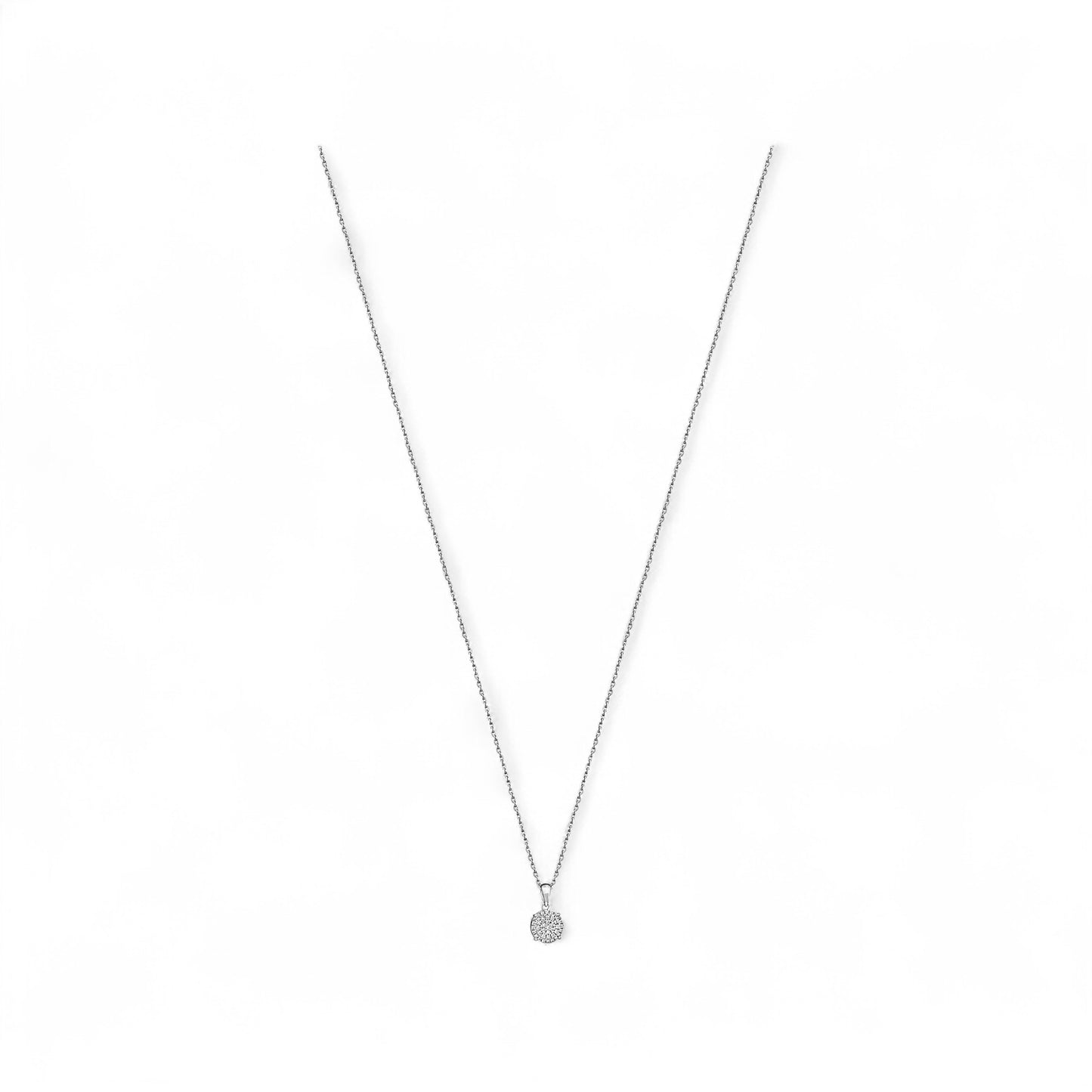 Silver necklace with a small round pendant on a white background