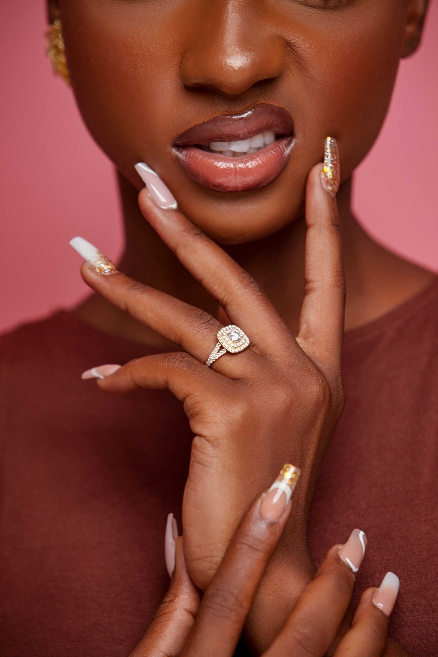 Audre Cushion Cut Moissanite engagement ring in 18K gold worn on hand with detailed nails