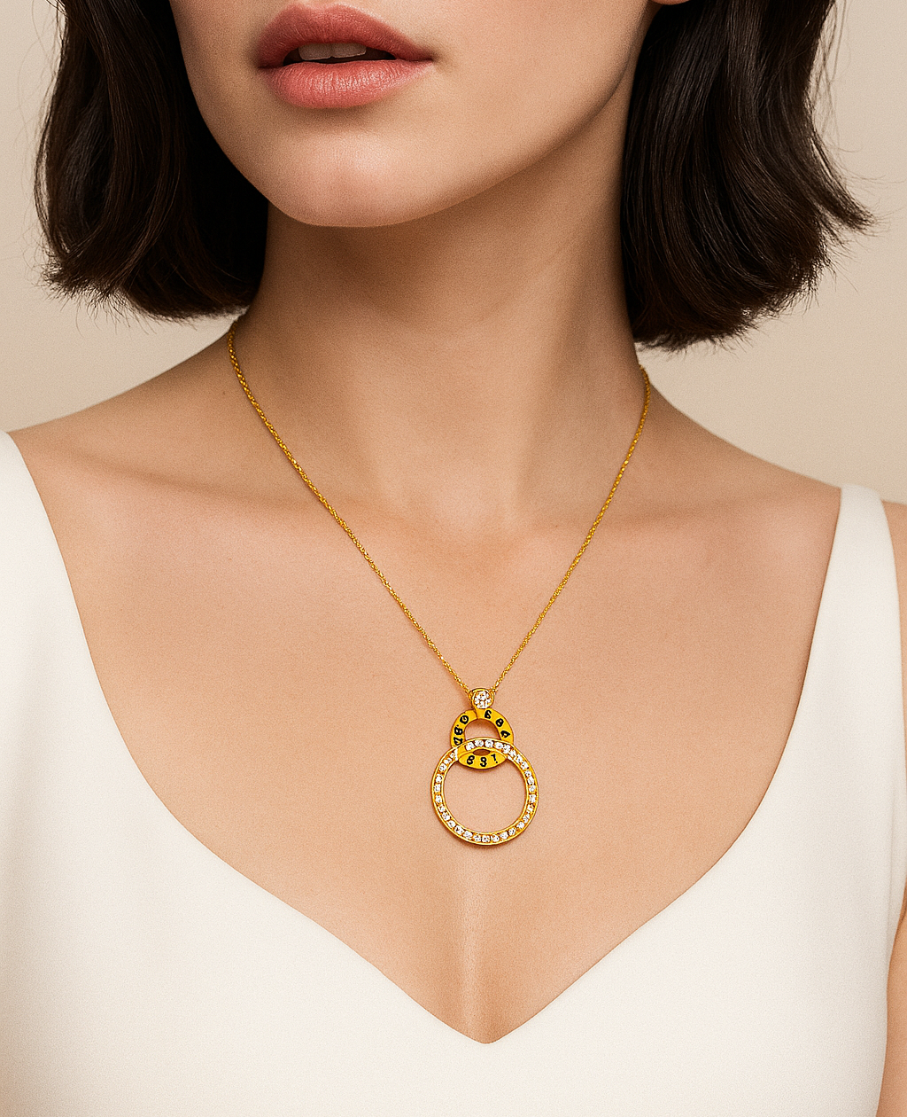 Woman wearing a gold necklace with a pendant against a beige background