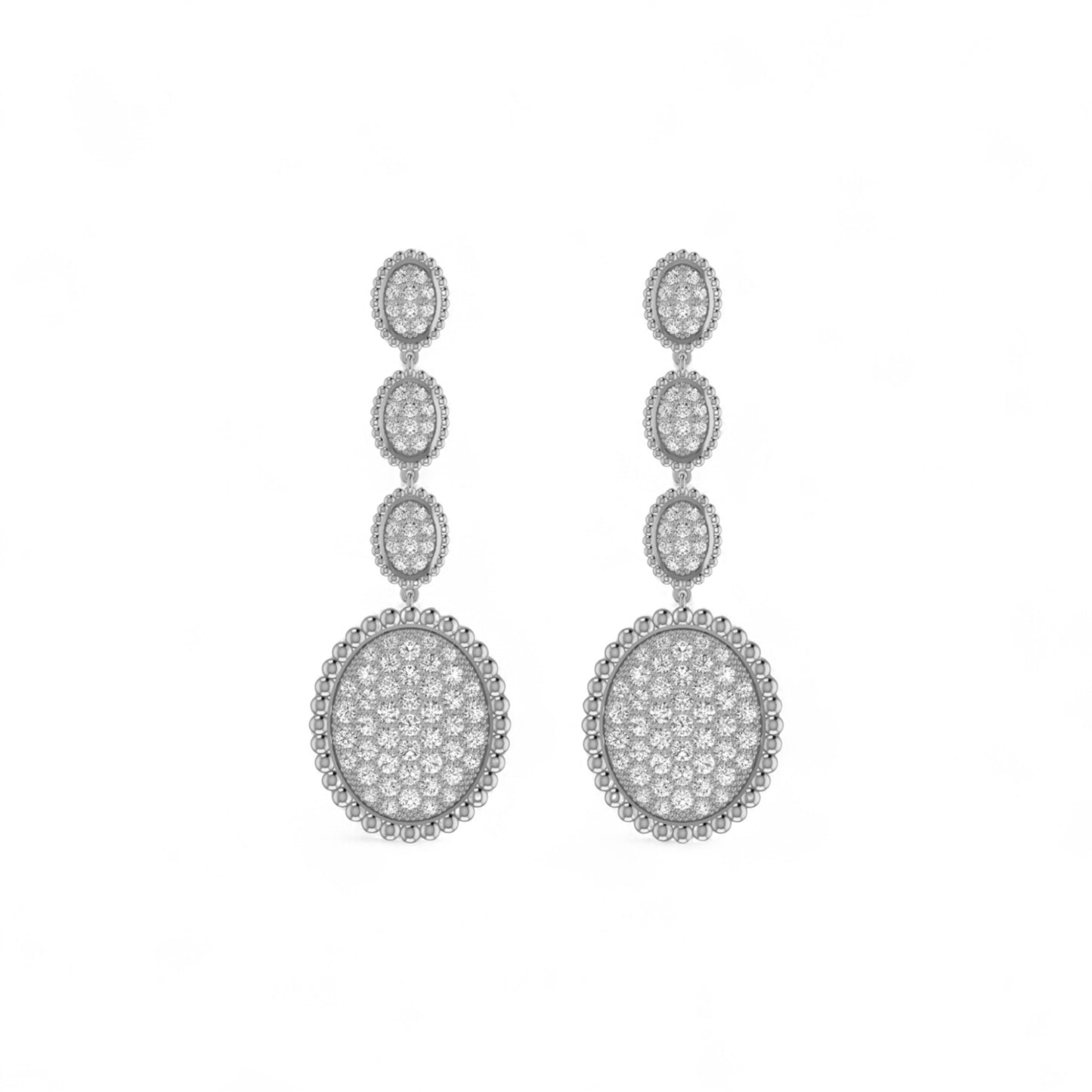 Pair of silver earrings with clear stones on a white background