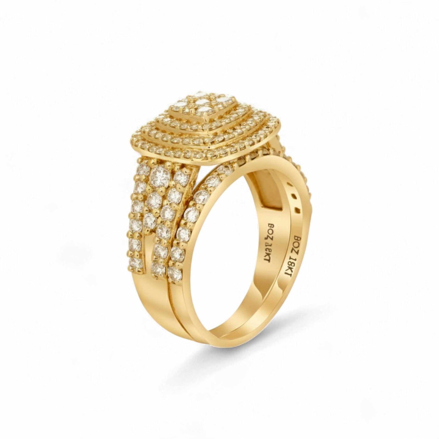 Gold ring with diamond accents on a white background