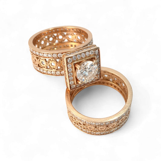 Rose gold ring with diamond on a white background