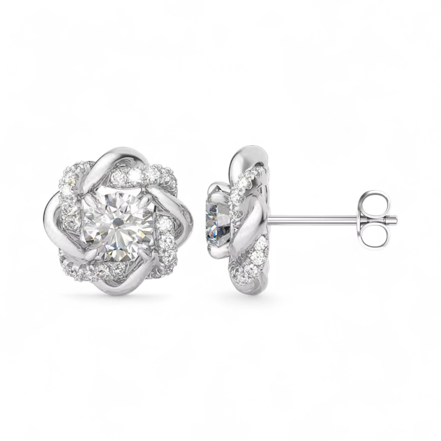 Silver earrings with a floral design and clear gemstones on a white background