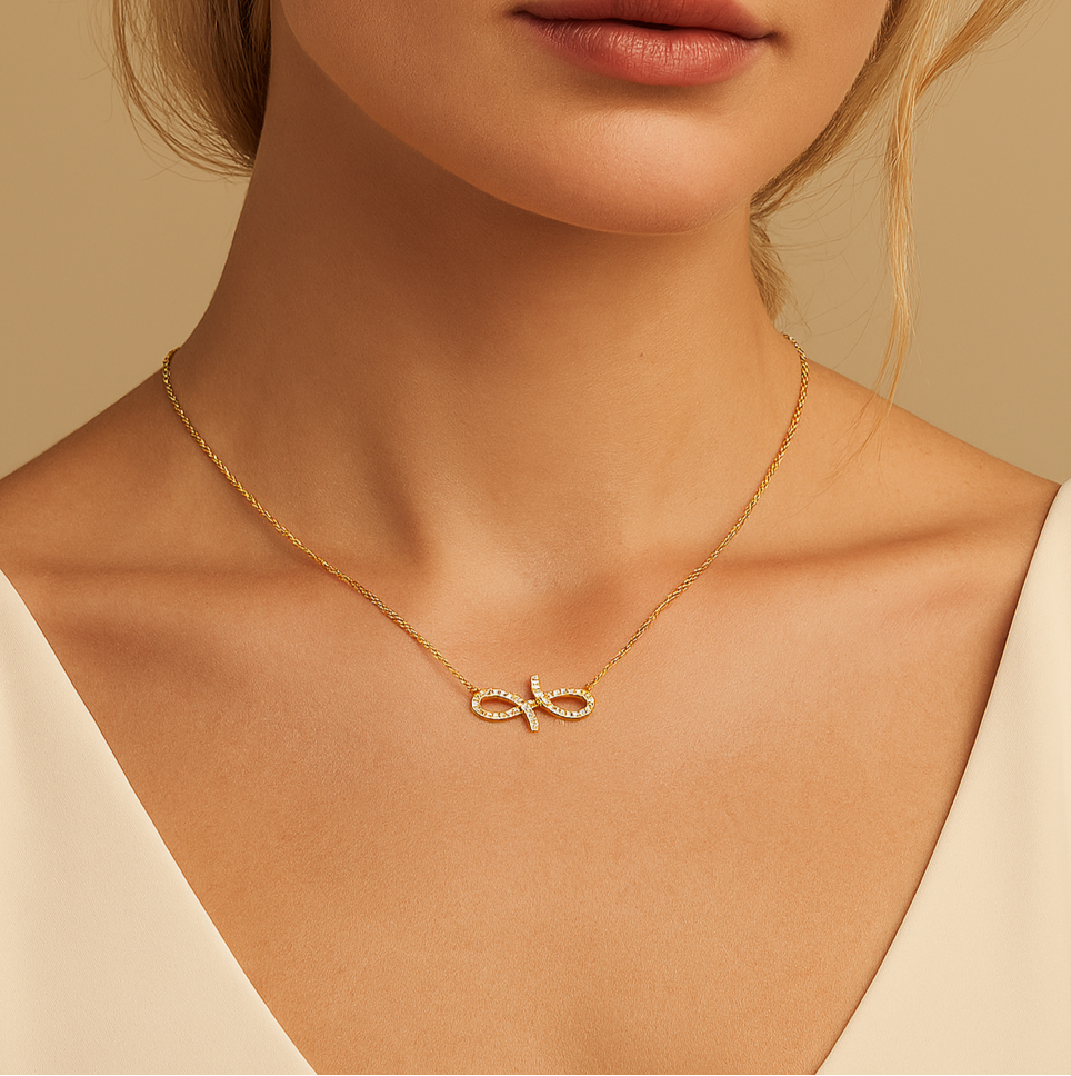 Gold necklace with a unique pendant on a model against a beige background