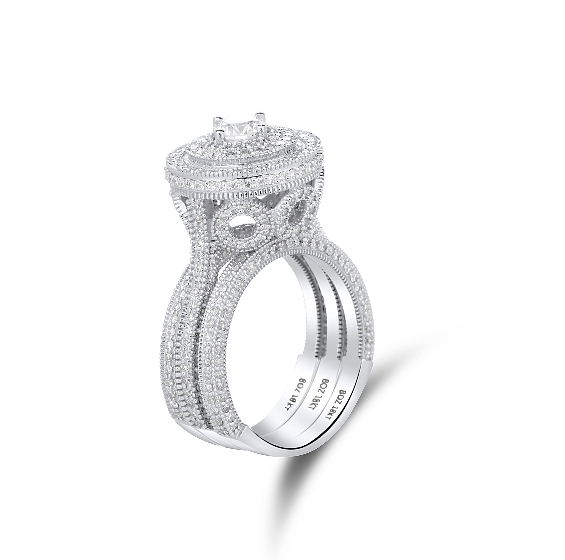 Silver ring with intricate design on a white background