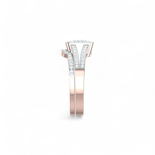 Rose gold and silver ring with diamond accents on a white background