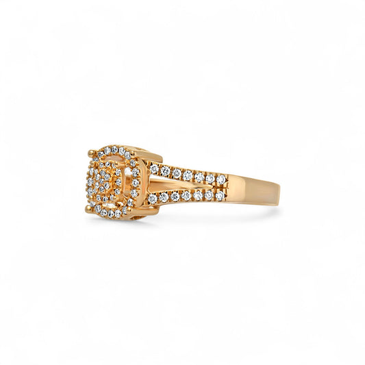 Gold ring with diamond accents on a white background