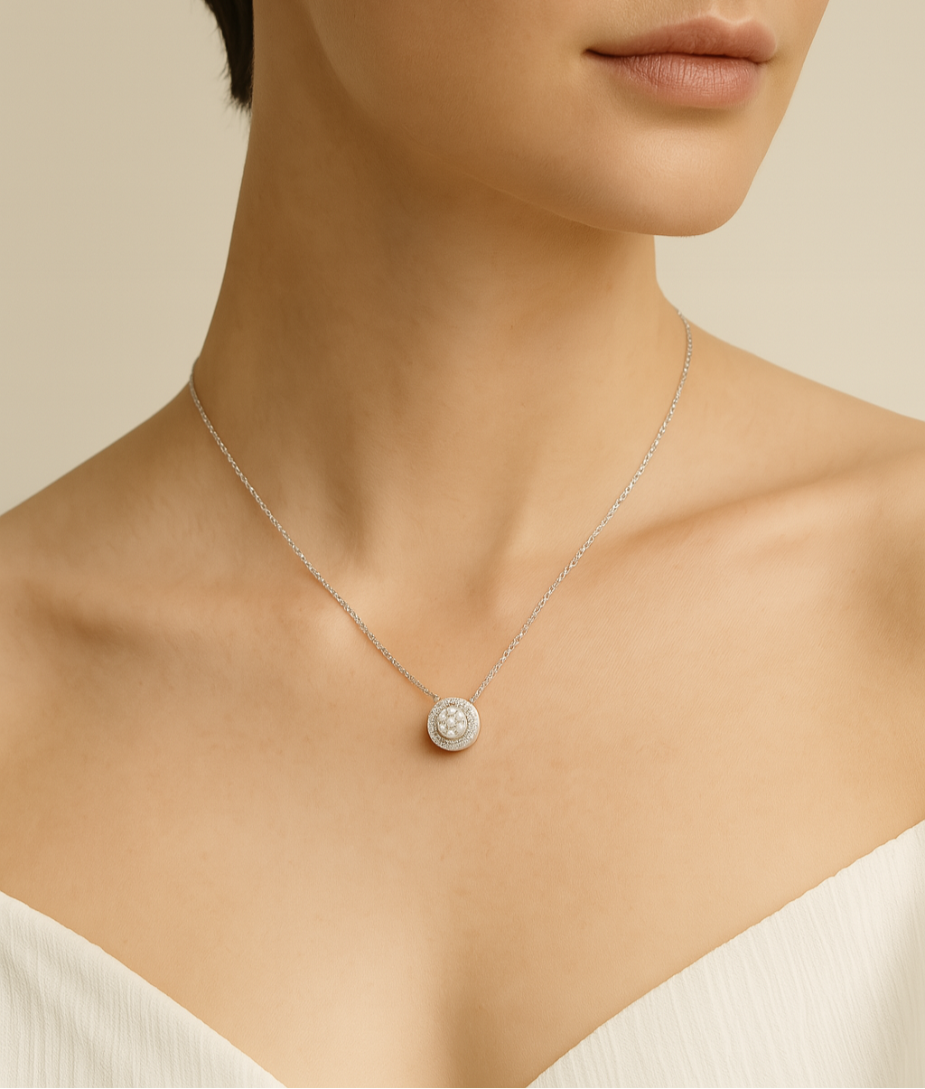Necklace with a round pendant worn by a model on a neutral background