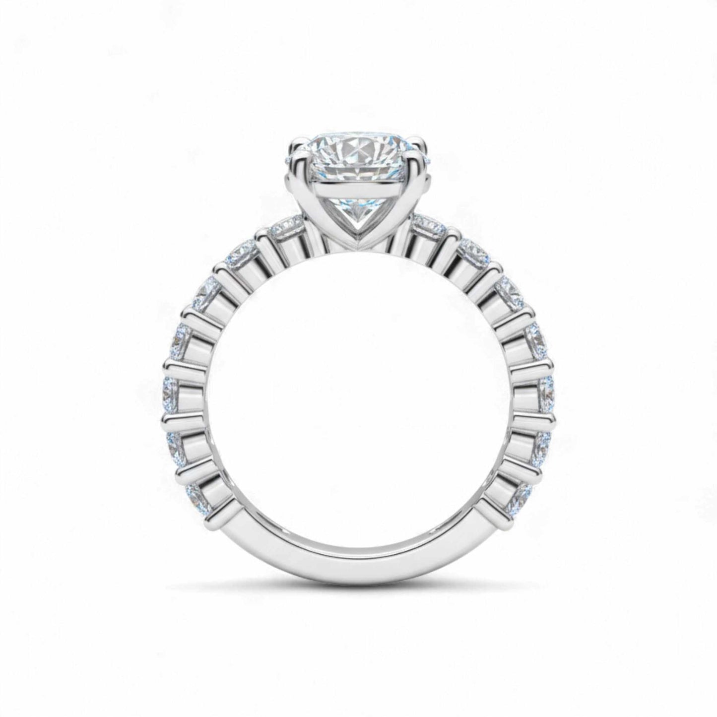 Diamond ring with a central gemstone and smaller stones on a white background