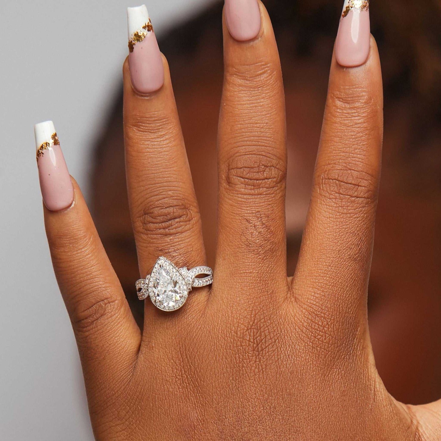 Bliss Pear Cut CZ Engagement Ring in 925 sterling silver with pear-shaped cubic zirconia on hand