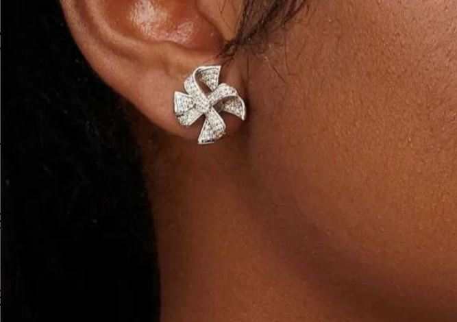 Willow Diamond Studs in 18K white gold featuring natural diamonds worn on ear