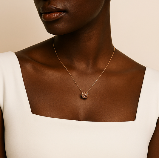 Necklace with a pendant on a model against a beige background