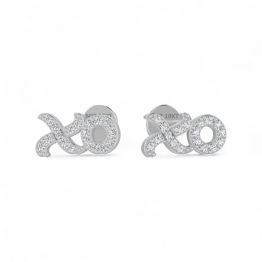 Silver 'xoxo' earrings on a white background