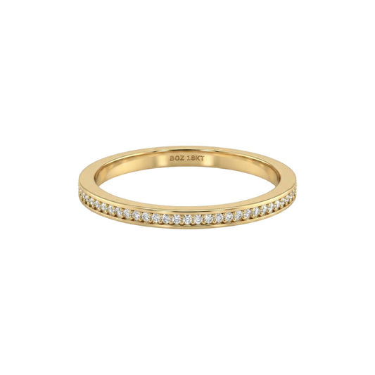 Gold ring with diamonds on a white background