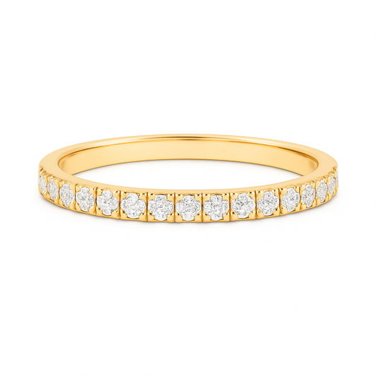 Gold ring with small diamonds on a white background