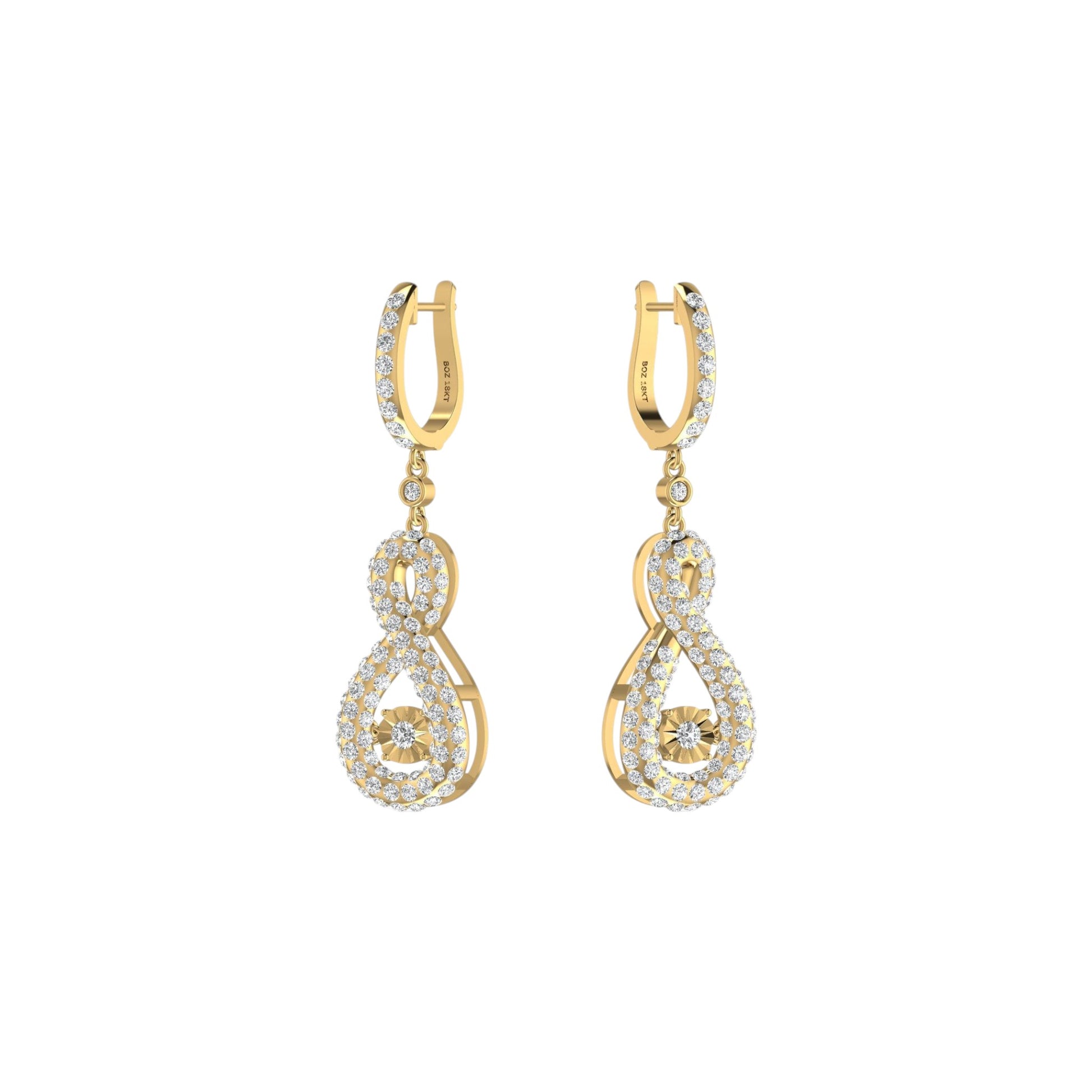 Gold and diamond earrings on a white background