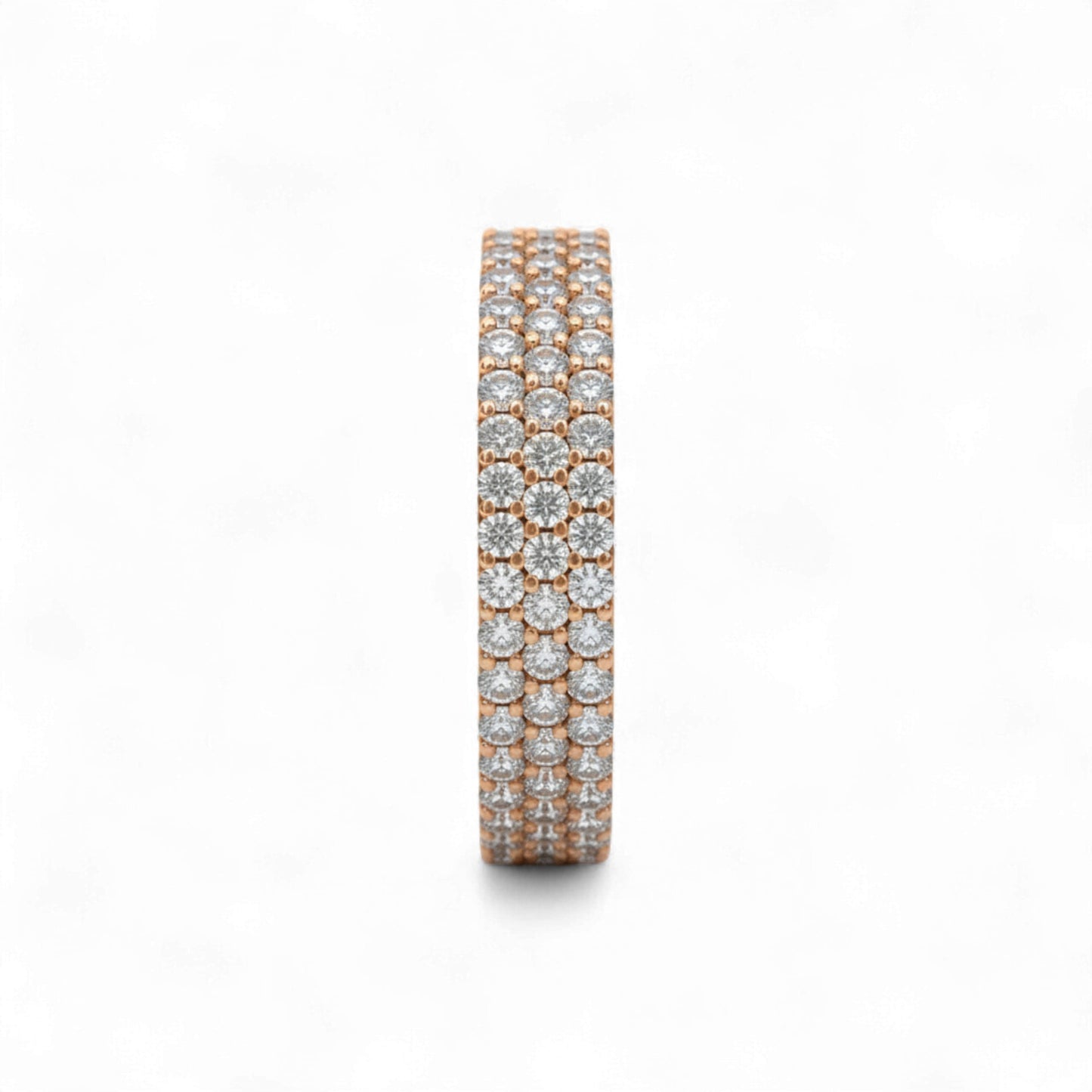 Rose gold and silver eternity ring with diamonds on a white background